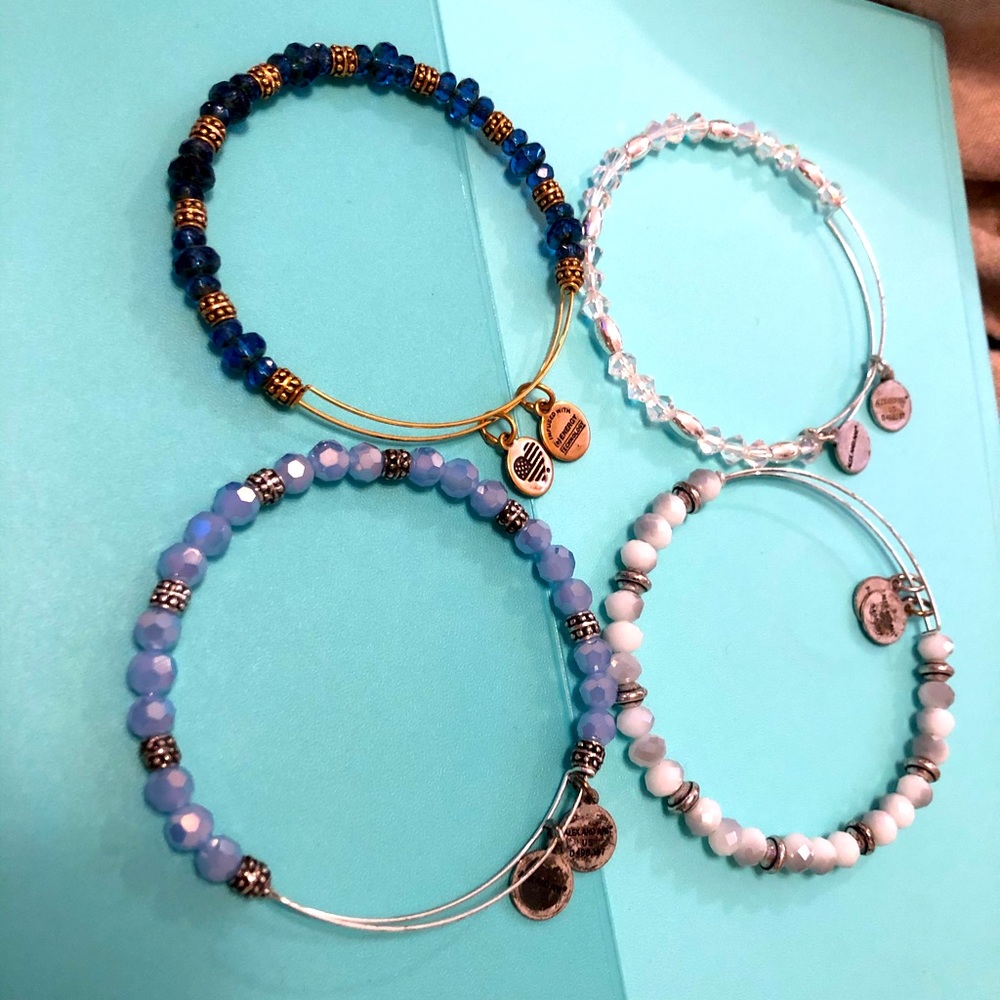 Four beaded Alex and Ani bracelets